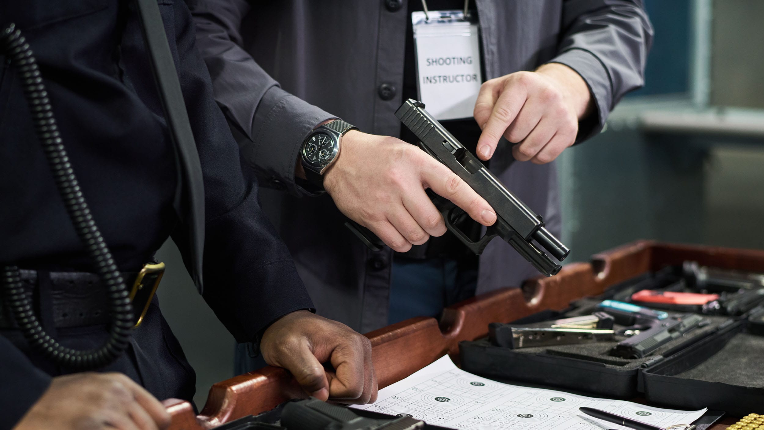 Shooting instructor explaining usage of firearms and safety procedures