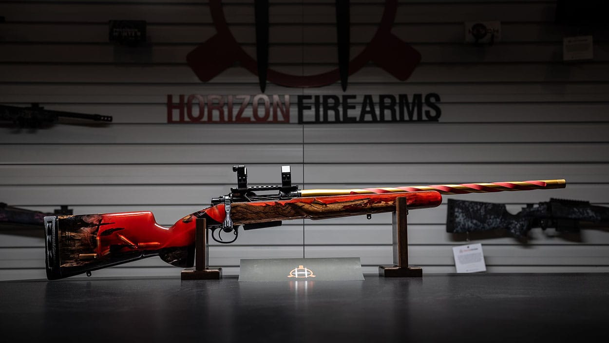 Rifle design red resin and wood engraved with the Hornady logo