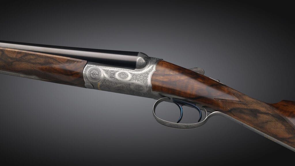 Double-barreled shotgun by Johann Fanzoj featuring ornate engravings and a polished wooden stock, set against a dark background.